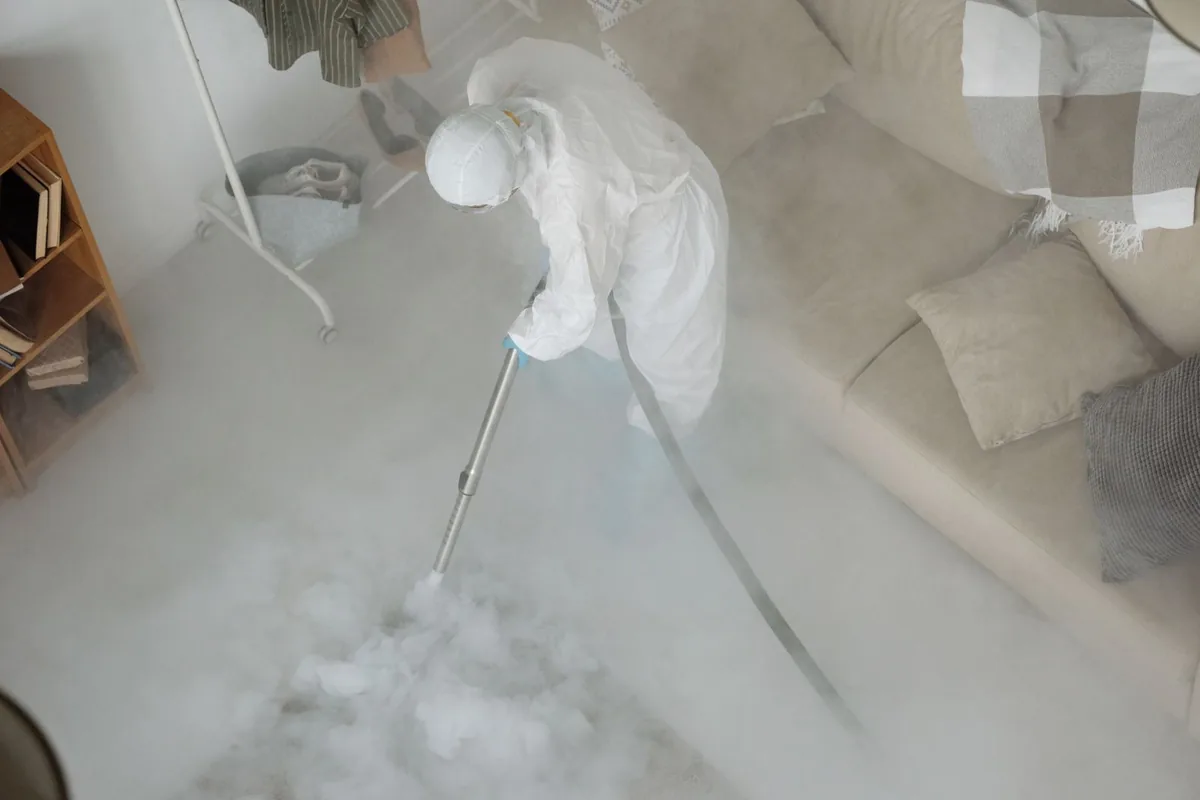 Biohazard cleanup technician in protective equipment, West Plains, MO